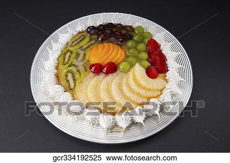 High angle view of a fruit flan on a plate View Large Photo Image Stock Photography - High angle view of a fruit flan on a plate. Fotosearch