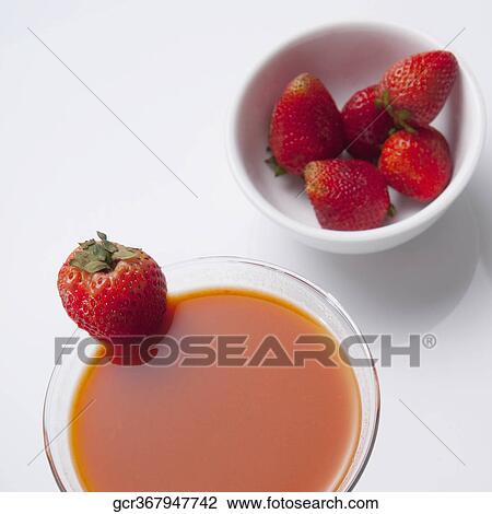 High angle view of a glass of strawberry martini View Large Photo Image Stock Image - High angle view of a glass of strawberry martini. Fotosearch
