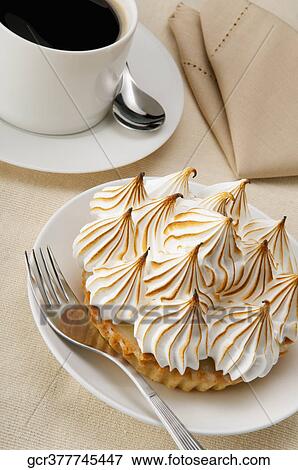 High angle view of a meringue pie with a cup of black coffee View Large Photo Image Stock Photo - High angle view of a meringue pie with a cup of black coffee. Fotosearch