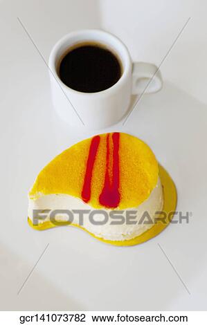 High angle view of a mousse pastry with a cup of black coffee View Large Photo Image Stock Image - High angle view of a mousse pastry with a cup of black coffee. Fotosearch