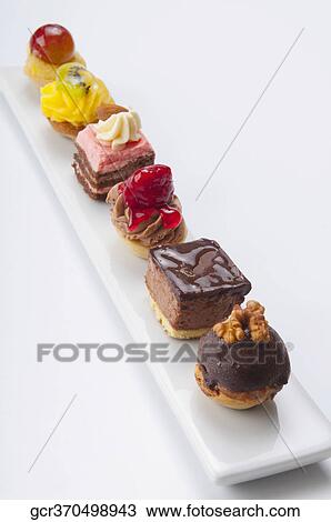 High angle view of a platter of assorted tarts and pastries View Large Photo Image Stock Image - High angle view of a platter of assorted tarts and pastries. Fotosearch