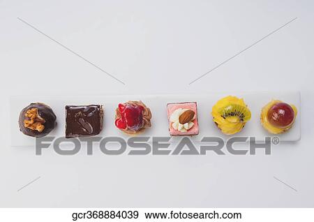 High angle view of a platter of assorted tarts and pastries View Large Photo Image Stock Photo - High angle view of a platter of assorted tarts and pastries. Fotosearch