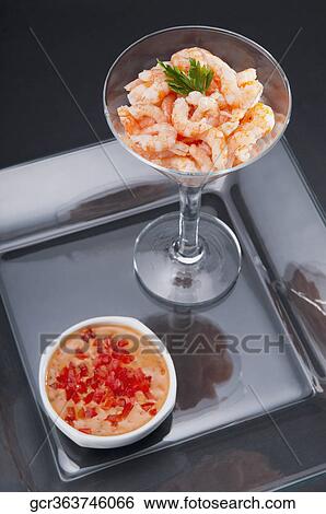 Stock Photograph - High angle view of a prawn cocktail with a soup bowl. Fotosearch