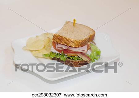 High angle view of a sandwich with chips View Large Photo Image Stock Photo - High angle view of a sandwich with chips. Fotosearch