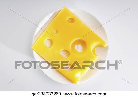 High angle view of a slice of emmenthal cheese View Large Photo Image Stock Image - High angle view of a slice of emmenthal cheese. Fotosearch