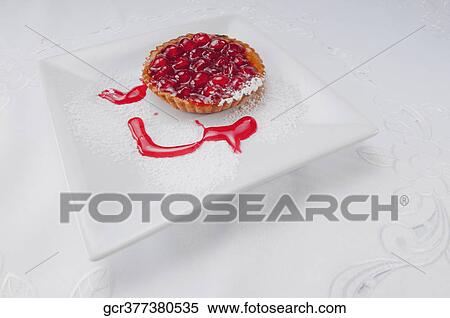 Stock Photography - High angle view of a strawberry tart on a tray. Fotosearch
