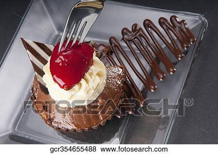 High angle view of a strawberry topped chocolate tart View Large Photo Image Stock Photo - High angle view of a strawberry topped chocolate tart. Fotosearch