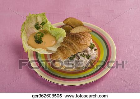 Stock Photography - High angle view of a tuna stuffed croissant. Fotosearch