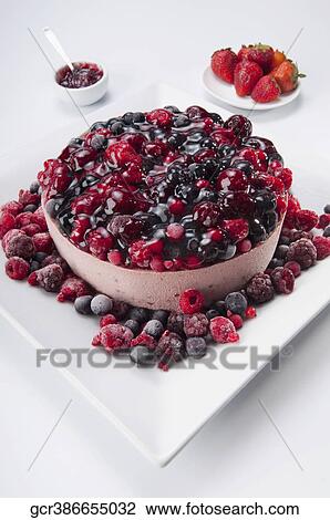 Stock Image - High angle view of an assorted berry mousse. Fotosearch