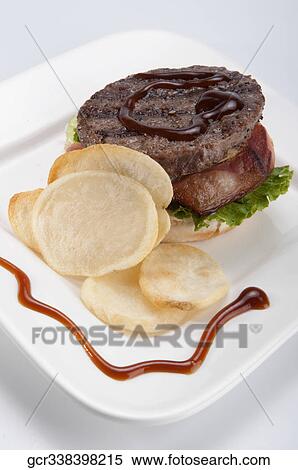 High angle view of an open burger with chips View Large Photo Image Stock Photography - High angle view of an open burger with chips. Fotosearch