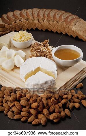 High angle view of assorted cheeses served with bread View Large Photo Image Stock Photograph - High angle view of assorted cheeses served with bread. Fotosearch
