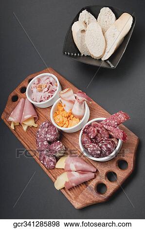 High angle view of assorted cold cuts and cheese View Large Photo Image Stock Photo - High angle view of assorted cold cuts and cheese. Fotosearch