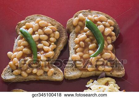 High angle view of baked beans on toasts with green chillies View Large Photo Image Stock Photo - High angle view of baked beans on toasts with green chillies. Fotosearch