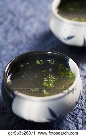 High angle view of bowls of clear soup View Large Photo Image Stock Image - High angle view of bowls of clear soup. Fotosearch