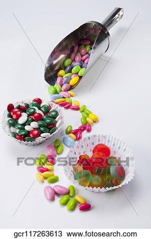 High angle view of candies with scoop View Large Photo Image Stock Image - High angle view of candies with scoop. Fotosearch