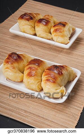 High angle view of croissants in platters View Large Photo Image Stock Photograph - High angle view of croissants in platters. Fotosearch