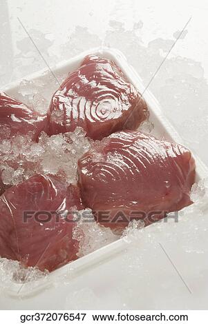 High angle view of fish medallions in a tray View Large Photo Image Stock Photo - High angle view of fish medallions in a tray. Fotosearch