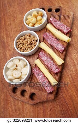 High angle view of ham and cheese rolls served with nuts and fruit View Large Photo Image Stock Image - High angle view of ham and cheese rolls served with nuts and fruit. Fotosearch