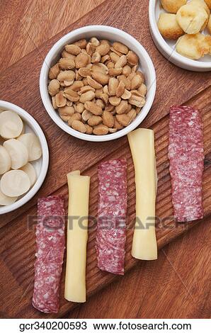 High angle view of ham and cheese rolls served with nuts and fruit View Large Photo Image Stock Image - High angle view of ham and cheese rolls served with nuts and fruit. Fotosearch