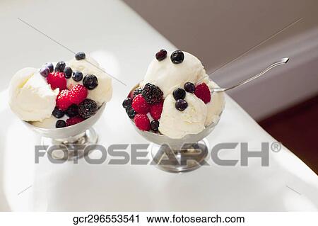 High angle view of ice cream topped with assorted berries View Large Photo Image Stock Image - High angle view of ice cream topped with assorted berries. Fotosearch