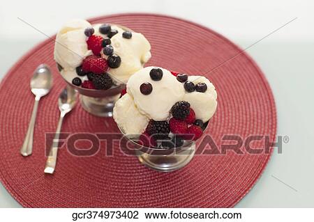 High angle view of ice cream topped with assorted berries View Large Photo Image Stock Image - High angle view of ice cream topped with assorted berries. Fotosearch