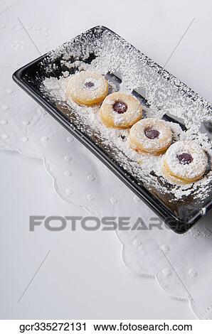 High angle view of jam cookies on a tray View Large Photo Image Stock Image - High angle view of jam cookies on a tray. Fotosearch