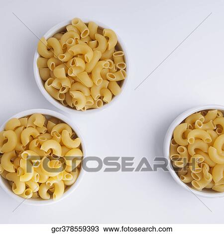 High angle view of macaroni in bowls View Large Photo Image Stock Image - High angle view of macaroni in bowls. Fotosearch