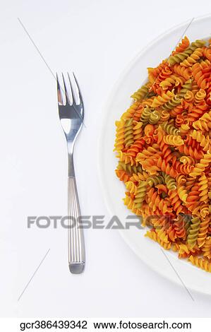 High angle view of multi colored fusilli View Large Photo Image Stock Image - High angle view of multi colored fusilli. Fotosearch