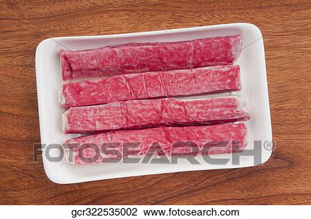 Stock Image - High angle view of octopus fingers on a tray. Fotosearch