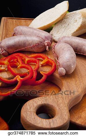 High angle view of sausages on a cutting board View Large Photo Image Stock Photography - High angle view of sausages on a cutting board. Fotosearch