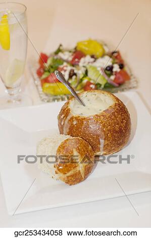 High angle view of soup served in a bread bowl with salad View Large Photo Image Stock Photo - High angle view of soup served in a bread bowl with salad. Fotosearch