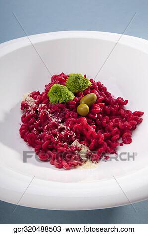 High angle view of spiral pasta topped with broccoli and olives View Large Photo Image Stock Image - High angle view of spiral pasta topped with broccoli and olives. Fotosearch