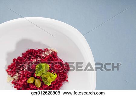 High angle view of spiral pasta topped with broccoli and olives View Large Photo Image Stock Photo - High angle view of spiral pasta topped with broccoli and olives. Fotosearch