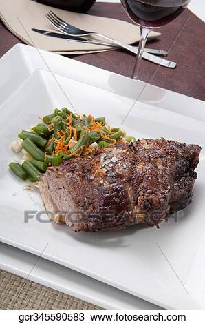 High angle view of steak served with green beans View Large Photo Image Stock Image - High angle view of steak served with green beans. Fotosearch