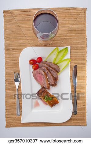 High angle view of steak served with red wine View Large Photo Image Stock Photo - High angle view of steak served with red wine. Fotosearch