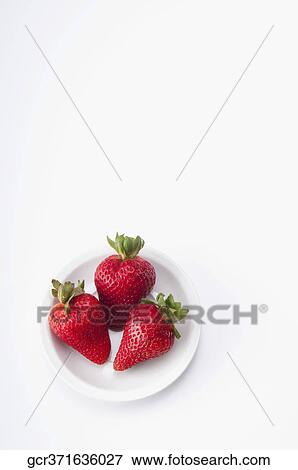 High angle view of strawberries in a plate View Large Photo Image Stock Photo - High angle view of strawberries in a plate. Fotosearch