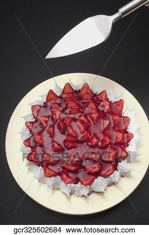 High angle view of strawberry meringue with a cake server View Large Photo Image Picture - High angle view of strawberry meringue with a cake server. Fotosearch