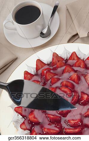 Picture - High angle view of strawberry meringue with a cup of coffee. Fotosearch
