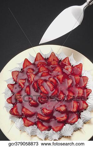 High angle view of strawberry meringue with a cake server View Large Photo Image Stock Image - High angle view of strawberry meringue with a cake server. Fotosearch