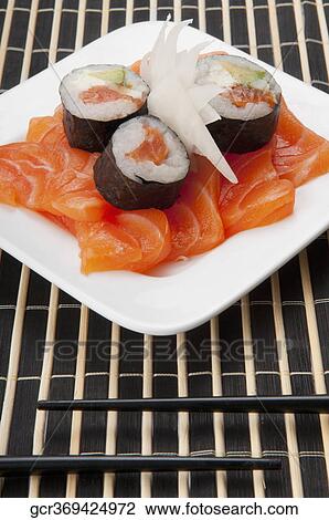 High angle view of sushi rolls on salmon slices View Large Photo Image Stock Image - High angle view of sushi rolls on salmon slices. Fotosearch