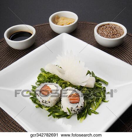 High angle view of sushi rolls served with condiments View Large Photo Image Stock Image - High angle view of sushi rolls served with condiments. Fotosearch