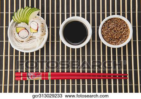 High angle view of sushi with sesame seeds and soy sauce View Large Photo Image Stock Image - High angle view of sushi with sesame seeds and soy sauce. Fotosearch