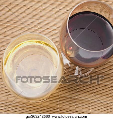 High angle view of two glasses of wine View Large Photo Image Stock Image - High angle view of two glasses of wine. Fotosearch