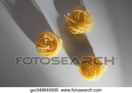 High angle view of uncooked pappardelle pasta View Large Photo Image Stock Image - High angle view of uncooked pappardelle pasta. Fotosearch