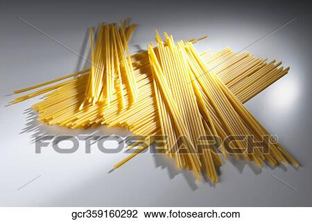 High angle view of uncooked spaghetti View Large Photo Image Stock Image - High angle view of uncooked spaghetti. Fotosearch