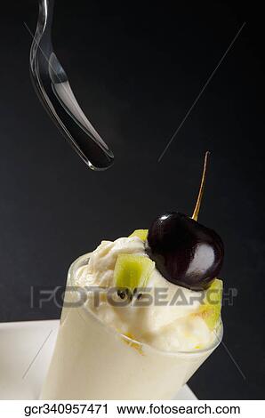 Kiwi fruit mousse garnish with black currant View Large Photo Image Stock Image - Kiwi fruit mousse garnish with black currant. Fotosearch