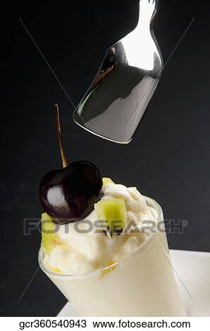 Kiwi fruit mousse garnish with black currant View Large Photo Image Stock Image - Kiwi fruit mousse garnish with black currant. Fotosearch