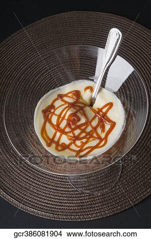 Lemon mousse with ice cream and caramel sauce in a martini glass View Large Photo Image Picture - Lemon mousse with ice cream and caramel sauce in a martini glass. Fotosearch
