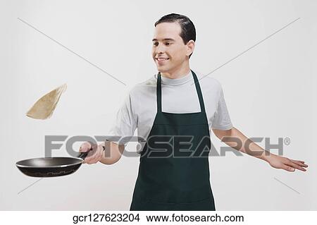 Man cooking omelet View Large Photo Image Picture - Man cooking omelet. Fotosearch