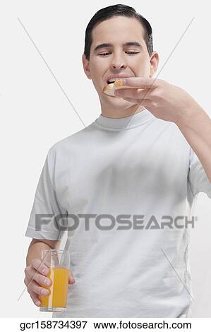 Man eating a toast View Large Photo Image Stock Photo - Man eating a toast. Fotosearch